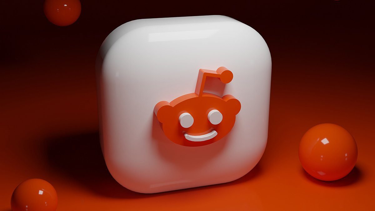 Icona stilizzata di Reddit in 3D su sfondo arancione, simboleggiando l'IPO di Reddit del 2023 e l'innovazione tecnologica